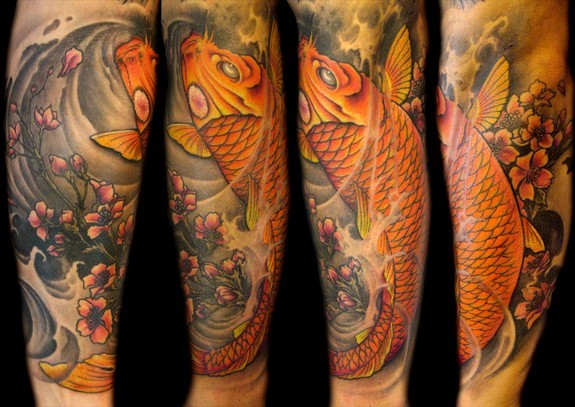 Mathew Clarke - Full color Koi fish half sleeve tattoo.